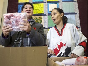 Lighthouse client Carmen Schick, right, and Federation of Sovereign Indigenous Nations (FSIN) Chief Bobby Cameron unpack donated meat after speaking with media at the Lighthouse in Saskatoon, SK on Wednesday, December 20, 2017. FSIN members donated wild meat for the holiday season at the Saskatchewan Indian Institute of Technologies campus and the Saskatoon Lighthouse.