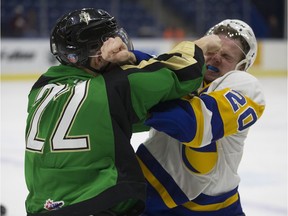 Blades forward Gage Ramsey gets into a fight with Prince Albert Raiders Carson Miller during the game at SaskTel Centre in Saskatoon, SK on Wednesday, December 27, 2017.