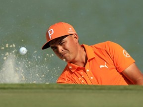 Rickie Fowler hits out of the bunker on the eighth hole during the final round of the Hero World Challenge in the Bahamas on Dec. 3, 2017.