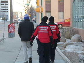 Community Support Officers (CSO) walk a man to the downtown bus loop in order to get him home safe after he was asked to leave a business in downtown Saskatoon on Nov. 30, 2017. While officers initially offered him a ride from a stabilization unit, he said he'd rather take the bus, and officers responded by working with transit officials to get him on the right bus.