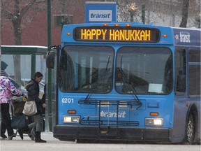 Saskatoon Transit is introducing a new service called the Jingle Bell Express that will take riders on a circuit of four malls for the Christmas shopping season. This photo shows a bus downtown in December of 2013.