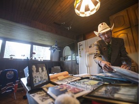 Bev Bentley pores over memorabilia at his Delisle home.