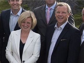 Alberta Premier Rachel Notley and Saskatchewan Premier Brad Wall during happier times in St. John's on July 16, 2015.