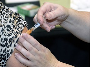 A patient receive a flu shot.