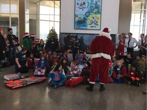 Kids from the Boys and Girls Clubs of Saskatoon meet up with Santa and receive some items from their wish list after the Searching for Santa Flight sponsored by Jazz Aviation on December 9, 2017 in Saskatoon. (Supplied)