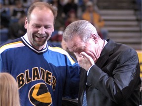 Former Saskatoon Blades coach Daryl Lubiniecki (right) gets a little emotional while greeting Wendel Clark after a ride around the ice at Credit Union Centre accompanied by wife Lolamae, grandson Joshua Hiltz and granddaughter Eden Janzen prior to a ceremony to honour him at Credit Union Centre (now SaskTel Centre) as a builder with the Western Hockey League hockey club.