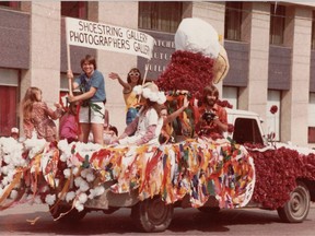 People from the Shoestring Gallery (which later became AKA) ride atop The Culture Vulture in the Pioneer Days Parade in 1981