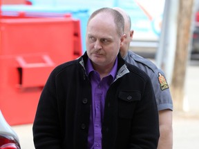 David Neil Woods arrives at Saskatoon Court of Queen's Bench during his trial on May 6, 2014. He was convicted of the first-degree murder of his wife Dorothy.