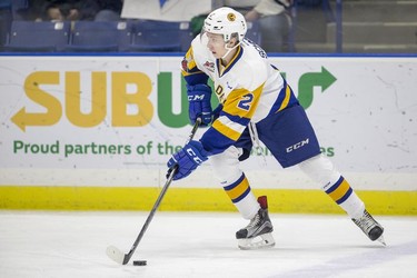 Saskatoon Blades defenceman  Randen Schmidt moves the puck against the Red Deer Rebels during first period WHL action in Saskatoon, SK on Friday, January 5, 2017.