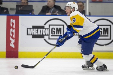 Saskatoon Blades defenceman  Seth Bafaro moves the puck against the Red Deer Rebels during first period WHL action in Saskatoon, SK on Friday, January 5, 2017.