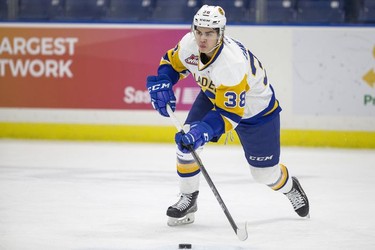 Saskatoon Blades forward  Alec Zawatsky moves the puck against the Red Deer Rebels during first period WHL action in Saskatoon, SK on Friday, January 5, 2017.