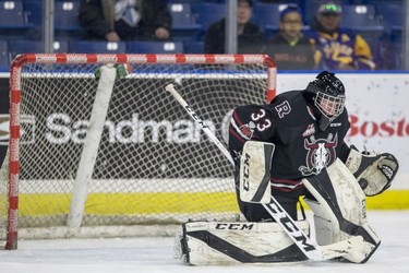 Red Deer Rebels goalie  Riley Lamb makes a save against the Saskatoon Blades during first period WHL action in Saskatoon, SK on Friday, January 5, 2017.