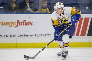 Saskatoon Blades forward  Bradly Goethals moves the puck against the Red Deer Rebels during first period WHL action in Saskatoon, SK on Friday, January 5, 2017.