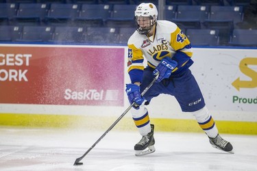 Saskatoon Blades defenceman  Evan Fiala moves the puck against the Red Deer Rebels in third period WHL action in Saskatoon, SK on Friday, January 5, 2017.