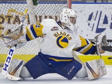 Saskatoon Blades goalie  Nolan Maier makes a save against the Red Deer Rebels in third period WHL action in Saskatoon, SK on Friday, January 5, 2017.