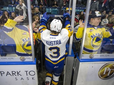 Fans and Saskatoon Blades defenceman Jake Kustra celebrates a blades win over the Red Deer Rebels in WHL action in Saskatoon, SK on Friday, January 5, 2017.