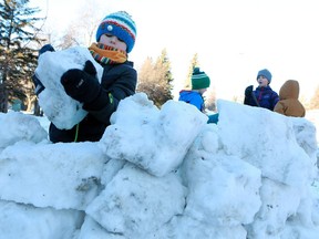 Now that the weather has warmed up, Sam Sayers can finally get outside to build a snow fort in Saskatoon on January 7, 2018.
