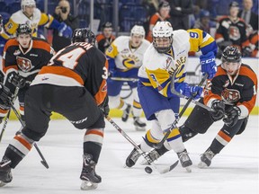 Saskatoon Blades forward Max Gerlach moves the puck against the Medicine Hate Tigers during second period WHL action in Saskatoon, January 10, 2018.