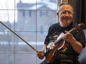 Jerry Kryzanowski, who has Down Syndrome and an acquired brain injury, plays the fiddle at his family's home in Saskatoon, SK on Wednesday, January 10, 2017. His family has been struggling to find an appropriate living situation for him.