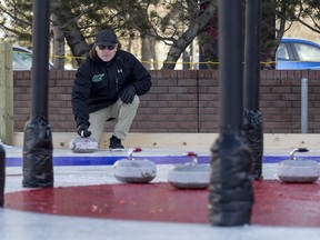 Saskatchewan Rush head coach Derek Keenan plays Crokicurl during a media event put on by the Broadway BID at the intersection of Broadway Avenue and 12th Street East in Saskatoon on Thursday, January 18, 2018.