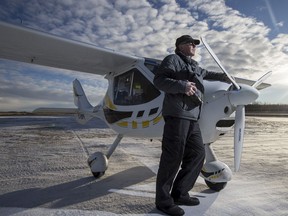 Ron Garnett, owner and founder of Airscapes, with his camera and his plane, a Flight Design CTSW, at the Corman Air Park.