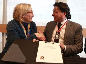 Minister of Crown-Indigenous Relations and Northern Affairs Carolyn Bennett and Whitecap Dakota First Nation Chief Darcy Bear sign a framework agreement for a possible Whitecap Dakota Treaty.