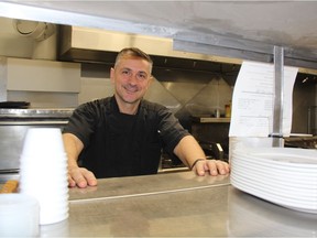 Petros Itskos, kitchen manager at Kisavos Restaurant and Lounge, smiles while working the line at the restaurant on Jan. 25, 2018. He’s happy to be back at the restaurant and said things are getting back to normal after it was closed for five months following a flooding incident in August 2017.