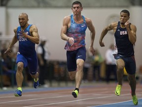 Blake Smith (centre) wins the men's 50-m dash at the K of C Games on Friday night.