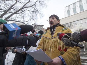 Former Metis Nations President, and '60s scoop survivor, Robert Doucette, left, speaks to media following filling a statement of claim against the Government of Saskatchewan and Government of Canada, outside of Court of Queen's Bench in Saskatoon on Monday, Jan. 29, 2018.