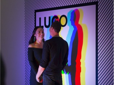 Lisa Langan, left, and Brian March stand in a photo booth at the Remai Modern during LUGO, a fundraiser for the Remai Modern in Saskatoon, SK on Saturday, January 13, 2018.