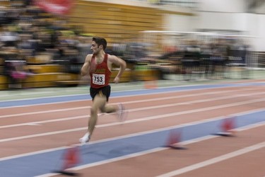 University of Calgary's Greg Ord runs down the track for the Seniors 1500 Meter Run during the University of Saskatchewan Huskies annual Sled Dog track and field meet at the Saskatoon Field House in Saskatoon, SK on Saturday, January 13, 2018.