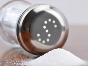 Salt being poured out of a salt shaker.