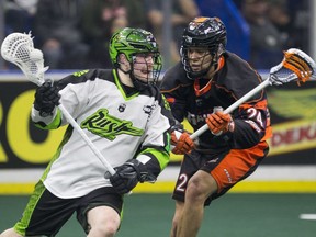 Rush forward Robert Church goes to move the ball past Buffalo Bandits forward Mitch Jones during the game at SaskTel Centre in Saskatoon on Friday, January 19, 2018.