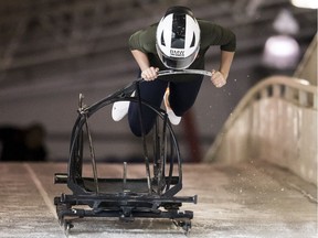 Saskatchewan bobsledder Julie Johnson launches a bare-bones training sled while working out in Whistler.