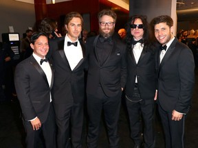 Greg Sestero, second from left attends the a Golden Globes afterparty with executive producer Scott Neustadter, Seth Rogen, Tommy Wiseau and executive producer Micheal H. Weber.