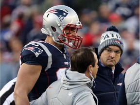 Rob Gronkowski #87 of the New England Patriots walks off the field after an injury in the second quarter  during the AFC Championship Game against the Jacksonville Jaguars at Gillette Stadium on January 21, 2018 in Foxborough, Massachusetts.