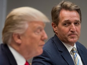 This file photo taken on December 5, 2017 shows Donald Trump during a lunch meeting with Republican members of the Senate, including Senator Jeff Flake, Republican of Arizona.