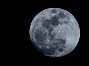 A photo taken on January 30, 2018 shows an almost full moon rising in the sky as seen from Netanya in central Israel. A cosmic event not seen in 36 years — a rare "super blood blue moon" — may be glimpsed on January 31 in parts of western North America, Asia, the Middle East, Russia and Australia.