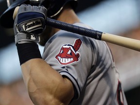 FILE - This June 26, 2015, file photo, shows the Cleveland Indians logo on a jersey during a baseball game against the Baltimore Orioles in Baltimore.  Indians are taking the divisive Chief Wahoo logo off their uniforms and caps, starting in 2019.