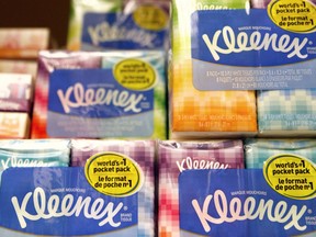 FILE - This Jan. 20, 2011, file photo shows packages of Kleenex tissues, a Kimberly Clark brand, at a store in San Francisco. Kimberly-Clark is cutting 5,000 to 5,500 jobs, or 12 percent to 13 percent of its workforce, as the consumer products company tries to lower costs. The Huggies and Kleenex maker said Tuesday, Jan. 23, 2018, that it plans to close or sell about 10 manufacturing plants while expanding production elsewhere.