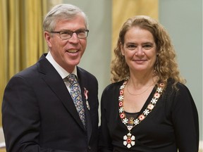 Governor General Julie Payette invests William Waiser, from Saskatoon, Sask. as a Member of the Order of Canada during a ceremony at Rideau Hall, Wednesday, January 24, 2018 in Ottawa.