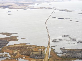 An October 2017 photo shows the 640 grid road partially submerged between what were the previously separate Big Quill and Little Quill Lakes.