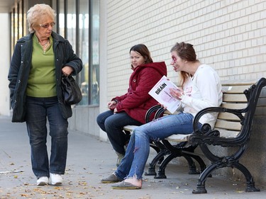 Onlookers react to Stephanie McKay's zombie look in 2013.