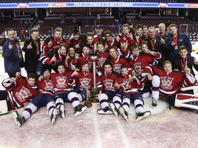 The Regina Pat Canadians celebrate a championship at the Mac's midget AAA hockey tournament Monday in Calgary.