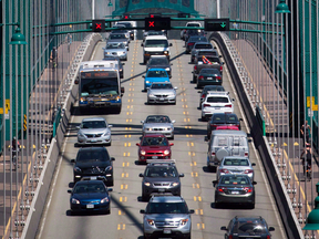 Traffic crosses over the Lions Gate Bridge from North Vancouver into Vancouver.
