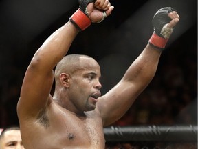 FILE - In this July 9, 2016, file photo, Daniel Cormier celebrates after defeating Anderson Silva during their light heavyweight mixed martial arts bout at UFC 200, in Las Vegas.