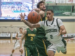 U of S Huskies guard JT Robinson leaps for the ball during the game at the PAC in Saskatoon, February 2, 2018.