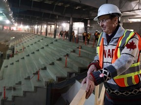 BESTPHOTO - Merlis Belsher takes a look at the spectator rink during a tour of Merlis Belsher Place under construction at the University of Saskatchewan in Saskatoon on February 6, 2018.