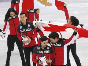 Canada's figure skaters celebrate their gold medal in the team event at the Pyeongchang Olympics on Feb. 12.