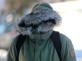 A student can barely see through his hood to keep warm on his walk to the University of Saskatchewan Monday morning in Saskatoon, SK on February 12, 2018.